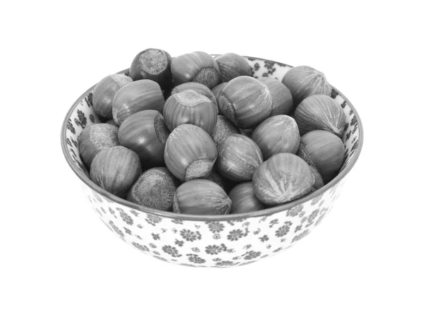 Hazelnuts in a china bowl — Stock Photo, Image