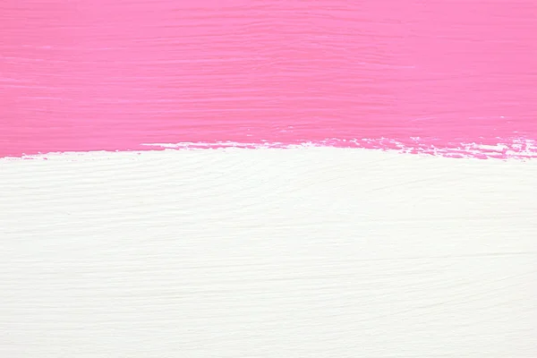 Listra de tinta rosa sobre fundo de madeira branco — Fotografia de Stock