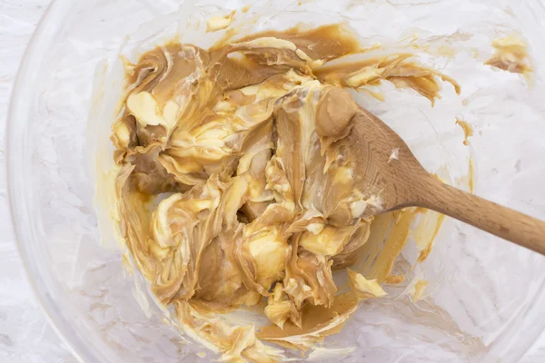 Combining butter and smooth peanut butter — Stock Photo, Image