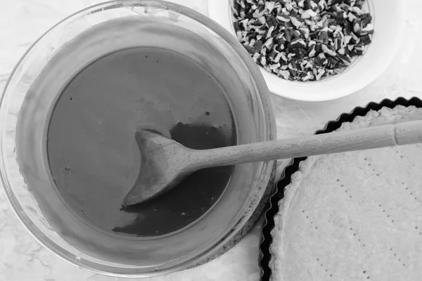 Making pecan pie - stirring the filling with a wooden spoon — Stock Photo, Image