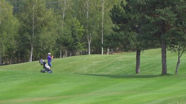 Bansko, Bulgaria - 12 Sep, 2019: Golfers hit sweeping golf course in the summer