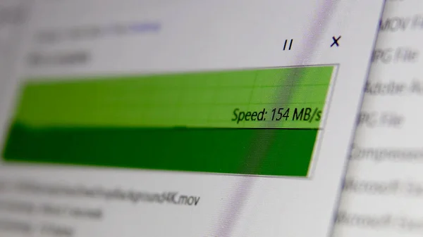 Copy a File Folder on Server Cloud with high internet speed. Closeup of Transfer progress bar showing a speed in Mbs