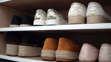 Woman take her favorite pair of summer shoes