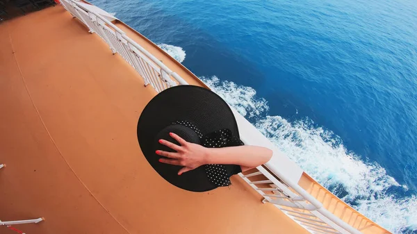 Cruise ship travel vacation woman looking at ocean from deck of sailing boat top viewCruise ship travel vacation woman looking at ocean from deck of sailing boat top view