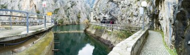 Panorama of dam crown, power station with walkway path. The dam is situated on the Matka River in Macedonia