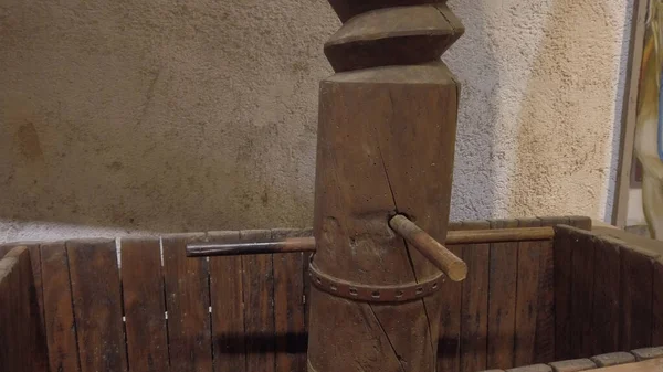 Ancient equipment tool for wine productiion at Koutsoyannopoulos Winery in Vothonas. In the cellars there are ancient objects and figures about how wine was produced in ancient times