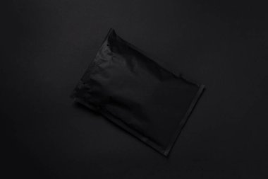 Black paper bubble envelope on dark background clipart