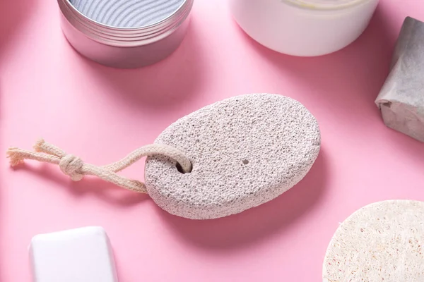 Bath tools, towel, cream and soap on toilet table