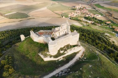 Aerial view of the ruins of an ancient medieval castle in Castrojeriz, Burgos, Spain. clipart