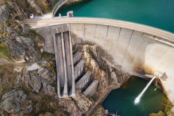 Aerial drone footage top view Water dam and reservoir lake, generating hydro electricity power renewable energy and sustainable development. High quality photo