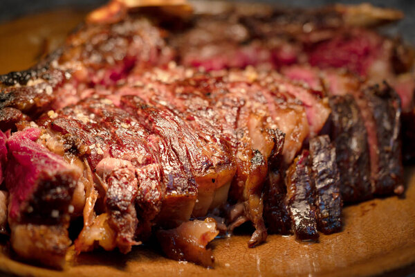 Sliced medium rare grilled beef steak ribeye close-up. High quality photo