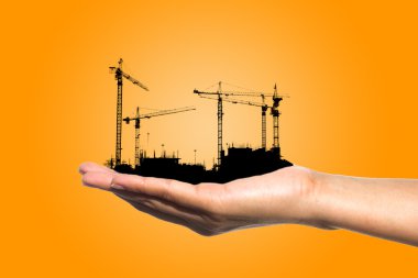 Siluate inşaat tutan el 