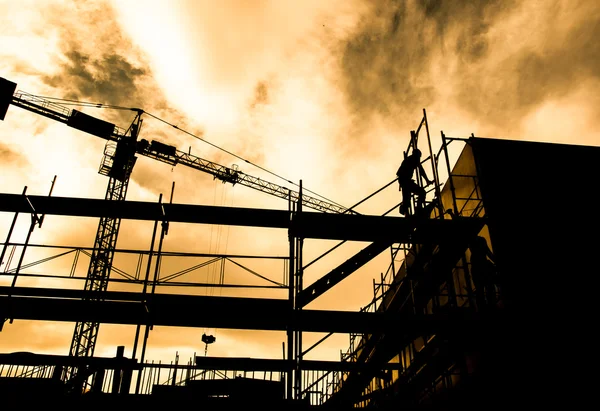 Silhouette of construction workers — Stock Photo, Image