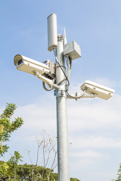 Security camera on blue sky — Stock Photo, Image