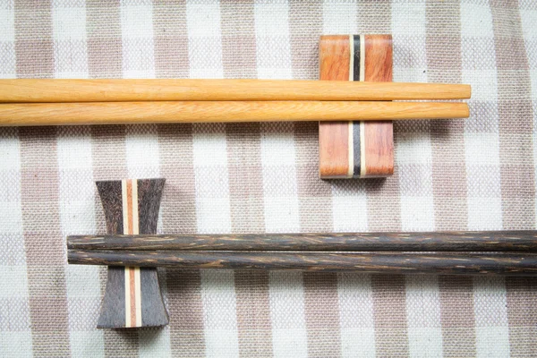 Wooden chopsticks on a fabric — Stock Photo, Image