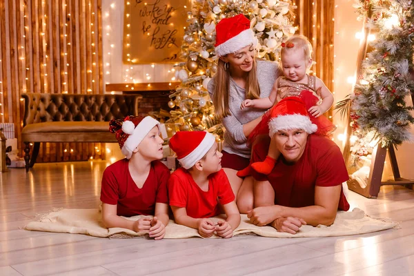 happy family of five at Christmas photo shoot