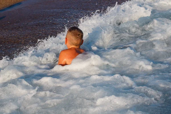 Boy Lies Waves Beach Sea Foam — Stock Photo, Image