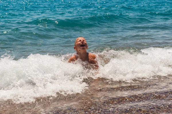 Nine Year Old Tanned Boy Swimming Trunks Plays Waves Sea — Stock Photo, Image