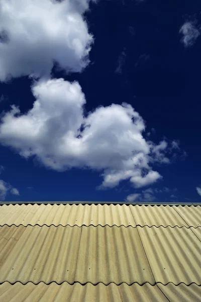 The roof of the house and the sky