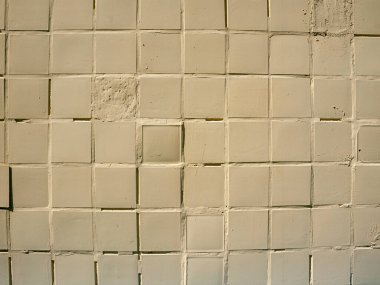Hasarlı krem, bej bloklar bej renkli küçük karelerin duvar arkaplanı
