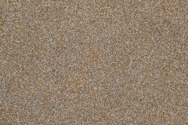 surface, stone plinth spatula made of small stones. Fine texture of small material