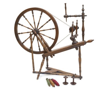 Antique spinning wheel with yarn and bobbins isolated on white clipart
