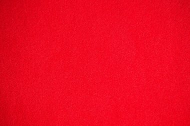 Soyut kırmızı arkaplan. Kumaşın yüzey dokusu bir yığın halinde. Desen.