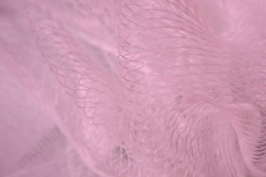 Pembe soyut arkaplanı bulanıklaştırmış. Ağ dokusu. Duvar Kağıdı.
