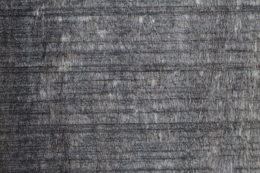 Bitmemiş karanlık bir tahta dokusu. Ahşap bir yüzeyin pürüzlü yapısı. Duvar kağıdı için arkaplan.