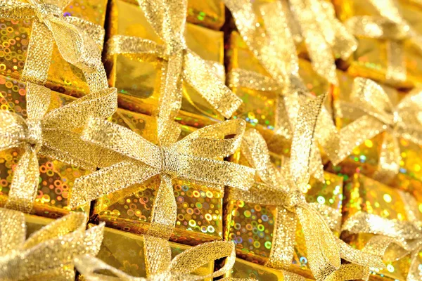 Top view of golden gifts close-up — Stock Photo, Image