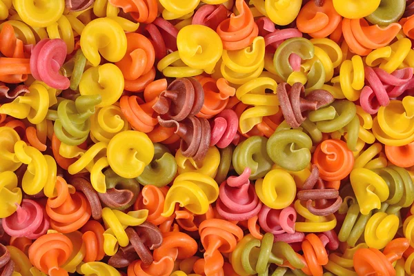 Colored italian pasta background — Stock Photo, Image