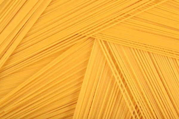 Uncooked Italian pasta spaghetti background — Stock Photo, Image