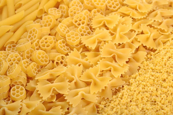 Assortment of uncooked Italian pasta close up — Stock Photo, Image