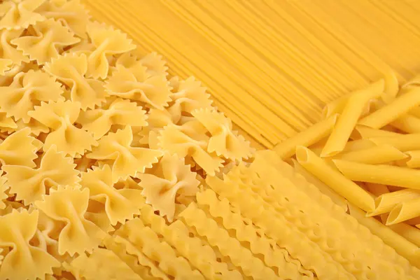 Assortment of uncooked Italian pasta close up — Stock Photo, Image