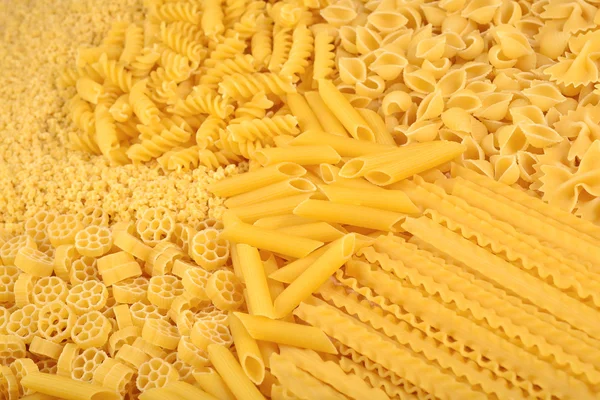 Assortment of uncooked Italian pasta close up — Stock Photo, Image