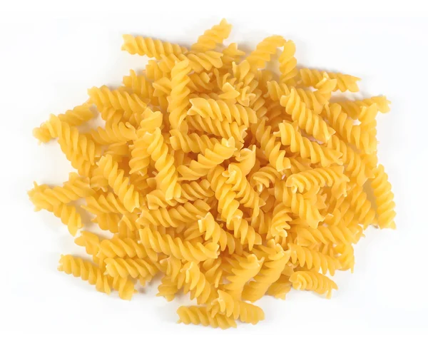 Heap of uncooked italian pasta fusilli on a white — Stock Photo, Image