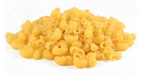 Heap of uncooked italian pasta pipe rigate on a white — Stock Photo, Image