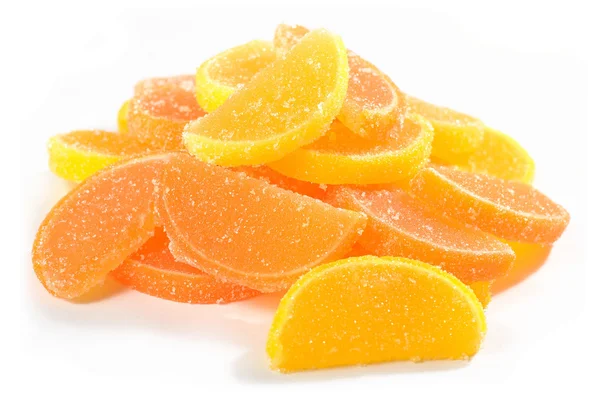 Heap of orange and lemon candy slices on a white — Stock Photo, Image