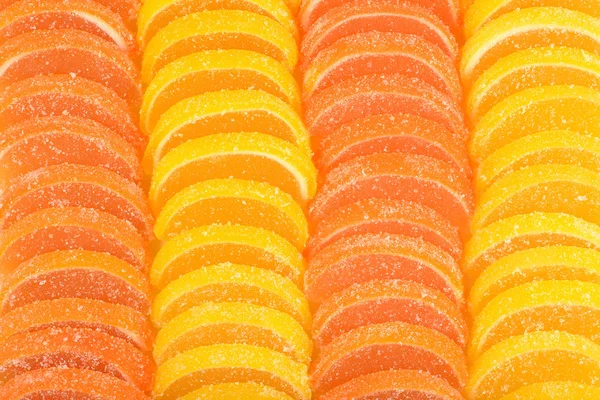 Orange and lemon candy slices as background — Stock Photo, Image