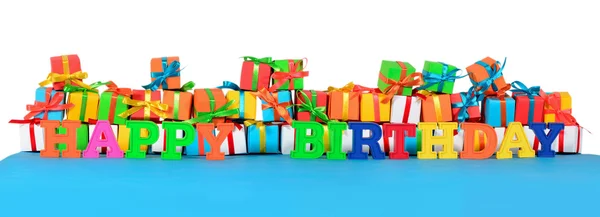 Happy birthday colorful text and varicolored gifts — Stock Photo, Image