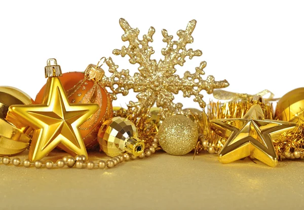 Golden Christmas decorations on a white — Stock Photo, Image