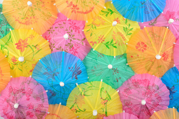 Colorful paper cocktail umbrella close-up 