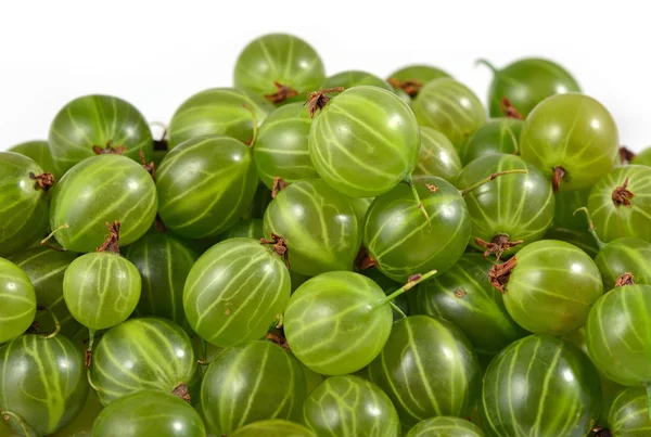 Heap of fresh green gooseberry close up on a white — Stock Photo, Image