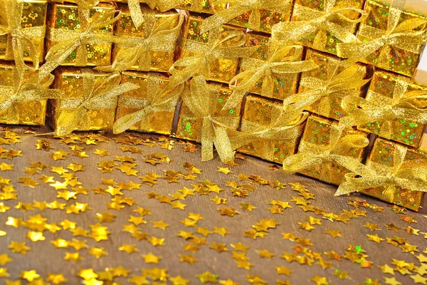 Golden gifts and golden stars Stock Image