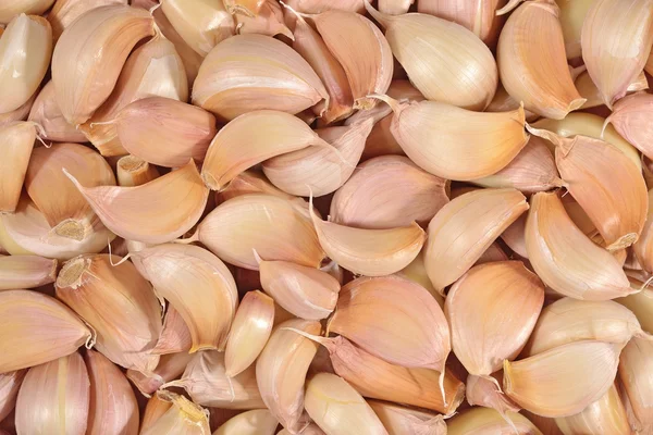 Garlic cloves background — Stock Photo, Image