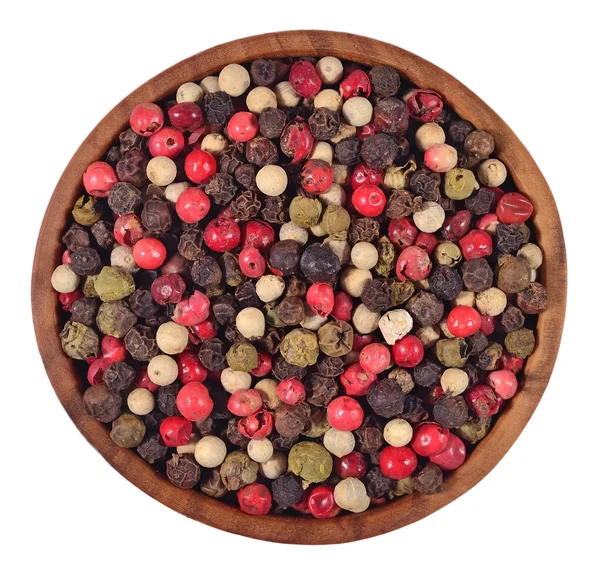 Colored pepper in a wooden bowl on a white — Stock Photo, Image