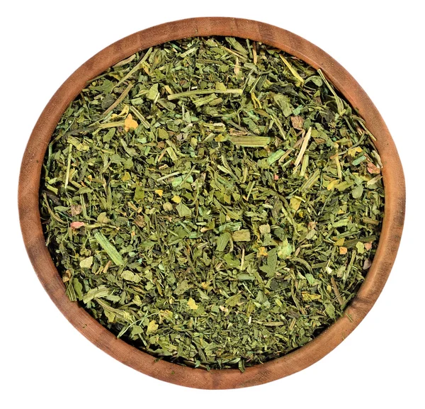 Dried parsley in a wooden bowl on a white — Stock Photo, Image