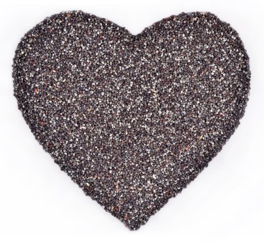 Beyaz bir kalp şeklinde haşhaş tohumu