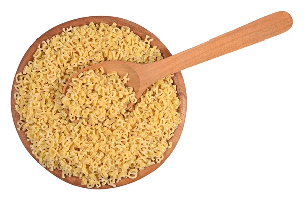 Alphabet pasta in a wooden bowl on a white — Stock Photo, Image