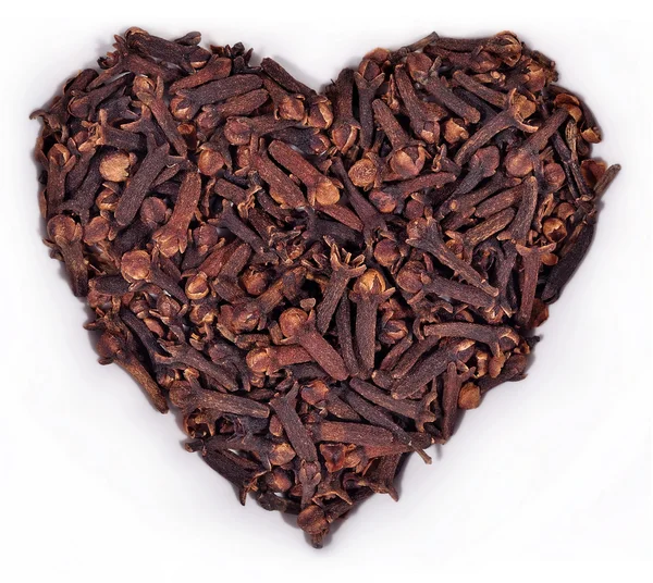 Dried clove in the form of heart on a white — Stock Photo, Image